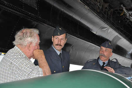 Re-enactors in bomb bay of FM-159